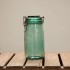 green glass storage jar