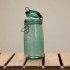 green glass storage jar