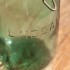 green glass storage jar