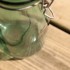 green glass storage jar